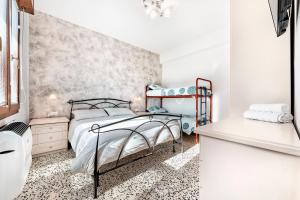 Postel nebo postele na pokoji v ubytování Jesolo Happy Beach House - Host Solution