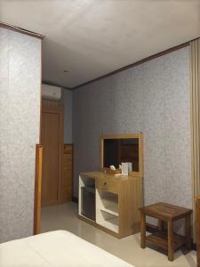 TV a/nebo společenská místnost v ubytování Bali Full Moon Guest House