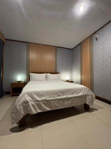 Postel nebo postele na pokoji v ubytování Bali Full Moon Guest House
