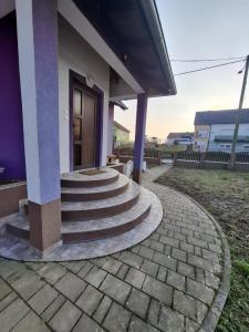 a group of stairs leading to a building at Apartman Konjević in Garešnica +10 photos