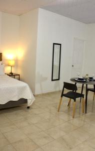 En eller flere senge i et værelse på Eco Villa, El Sunzal ISA Surfing