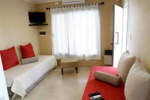 Et opholdsområde på Departamentos Recalada Suites