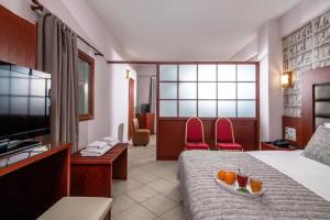 Televízia a/alebo spoločenská miestnosť v ubytovaní City Life Hotel