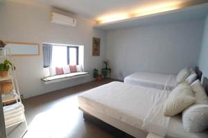 Postel nebo postele na pokoji v ubytování 山森三室墾丁南灣包棟民宿3Rooms