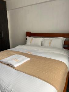 Ένα ή περισσότερα κρεβάτια σε δωμάτιο στο Stylish 2 bedrooms in kericho town