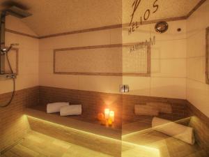 a bathroom with a shower and a tub with candles at Chalet luxe 5★, 6 pers, hammam, près des pistes, 3 chambres - FR-1-304-305 in La Clusaz +11 photos