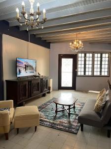a living room with a couch and a coffee table at Baan Saen Saran residence in Sathani Bang Ramat