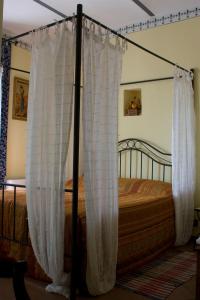 Postel nebo postele na pokoji v ubytování Arco Dei Nobili