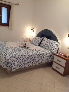 Ένα ή περισσότερα κρεβάτια σε δωμάτιο στο Casetta Anacaprese