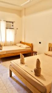 Postel nebo postele na pokoji v ubytování James Homestay