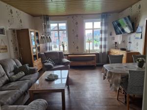 TV a/nebo společenská místnost v ubytování Großes Ferienhaus Nordhastedt 2- 6 Personen 16 km zur Nordsee 24 km Büsum 45km St Peter Ording