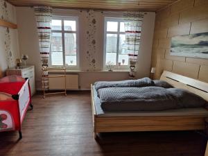 Postel nebo postele na pokoji v ubytování Großes Ferienhaus Nordhastedt 2- 6 Personen 16 km zur Nordsee 24 km Büsum 45km St Peter Ording