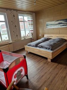 Postel nebo postele na pokoji v ubytování Großes Ferienhaus Nordhastedt 2- 6 Personen 16 km zur Nordsee 24 km Büsum 45km St Peter Ording