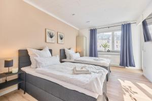 Postel nebo postele na pokoji v ubytování Schöne Wohnung Ludwigshafen Balkon WLAN Zentrale Lage