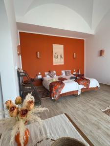 Postel nebo postele na pokoji v ubytování Maison d'hôtes Dar El Kahina Djerba + 25 fotografií