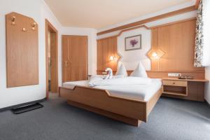 Postel nebo postele na pokoji v ubytování SCHMID Rooms & Apartments