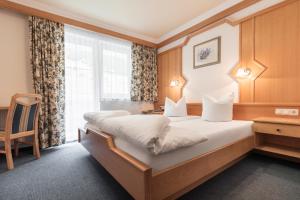 Posteľ alebo postele v izbe v ubytovaní SCHMID Rooms & Apartments