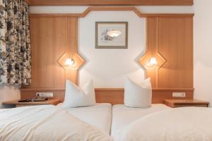 Postel nebo postele na pokoji v ubytování SCHMID Rooms & Apartments