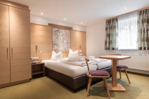 Postel nebo postele na pokoji v ubytování SCHMID Rooms & Apartments