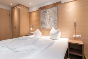 Postel nebo postele na pokoji v ubytování SCHMID Rooms & Apartments