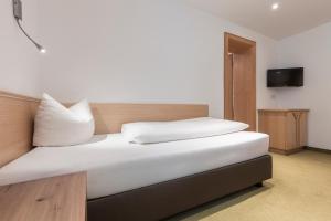 Postel nebo postele na pokoji v ubytování SCHMID Rooms & Apartments