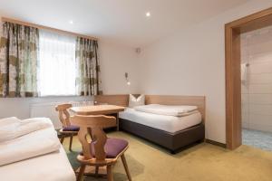 Postel nebo postele na pokoji v ubytování SCHMID Rooms & Apartments