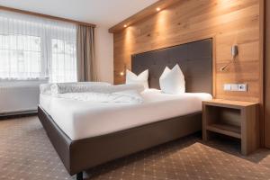 Postel nebo postele na pokoji v ubytování SCHMID Rooms & Apartments