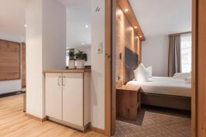 Postel nebo postele na pokoji v ubytování SCHMID Rooms & Apartments