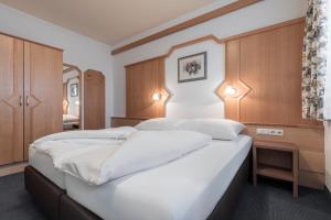 Postel nebo postele na pokoji v ubytování SCHMID Rooms & Apartments