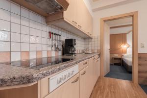 Kuchyň nebo kuchyňský kout v ubytování SCHMID Rooms & Apartments