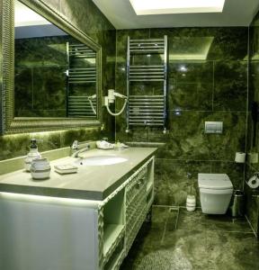 A bathroom at Asya Hotel