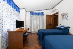 TV a/nebo společenská místnost v ubytování B&B Villa Dei Desideri