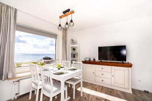 TV a/nebo společenská místnost v ubytování Hanseat I Whg 77 "Panoramablick"