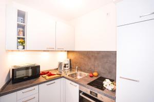 Kuchyň nebo kuchyňský kout v ubytování Hanseat I Whg 77 "Panoramablick"