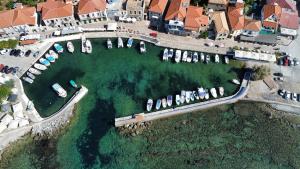 an aerial view of a marina with boats in the water at Παραθαλάσσιο Studio in Agios Nikolaos +6 photos