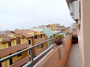 a view from a balcony of buildings at BlueCharme modern apartment in Quartu SantʼElena