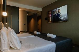 Lumière Hotel Pool & SPA客房内的一张或多张床位