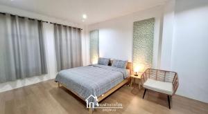 Ένα ή περισσότερα κρεβάτια σε δωμάτιο στο บ้านพักชายโขง นครพนม b2