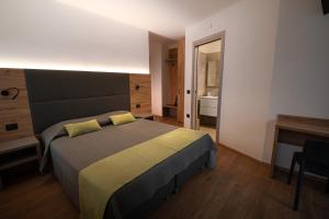 Postel nebo postele na pokoji v ubytování Hotel Del Negro