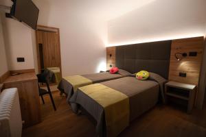 Postel nebo postele na pokoji v ubytování Hotel Del Negro