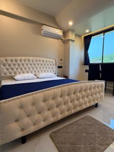 Postel nebo postele na pokoji v ubytování Elite Residency + 31 fotografií