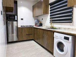 Kuchyň nebo kuchyňský kout v ubytování Accommodation Guru