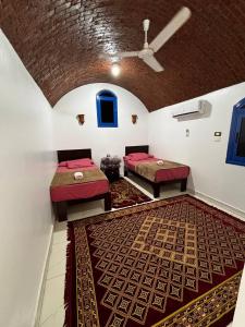 Voodi või voodid majutusasutuse Ajwa Guest House toas