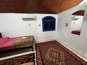 Voodi või voodid majutusasutuse Ajwa Guest House toas