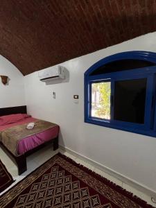 Voodi või voodid majutusasutuse Ajwa Guest House toas