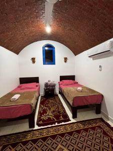 Voodi või voodid majutusasutuse Ajwa Guest House toas