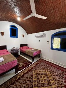 Voodi või voodid majutusasutuse Ajwa Guest House toas