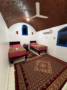 Voodi või voodid majutusasutuse Ajwa Guest House toas