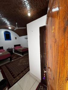 Voodi või voodid majutusasutuse Ajwa Guest House toas
