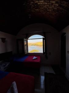 Voodi või voodid majutusasutuse Ajwa Guest House toas